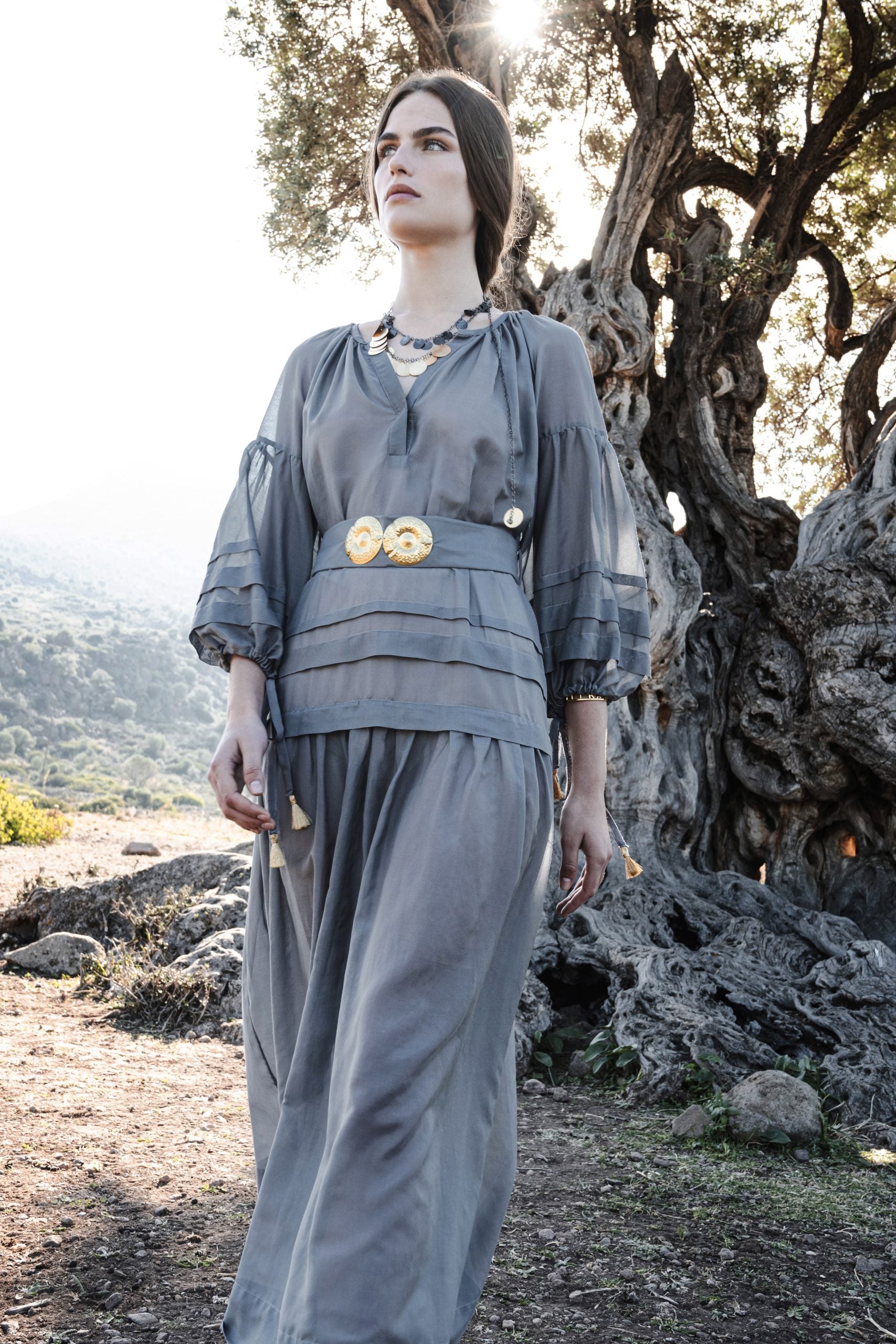 MYKONOS LONG DRESS WITH GOLDEN BUCKLES AND TASSELS STONE GREY